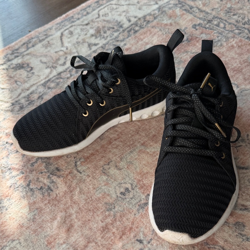 Puma Black and Gold Sneakers